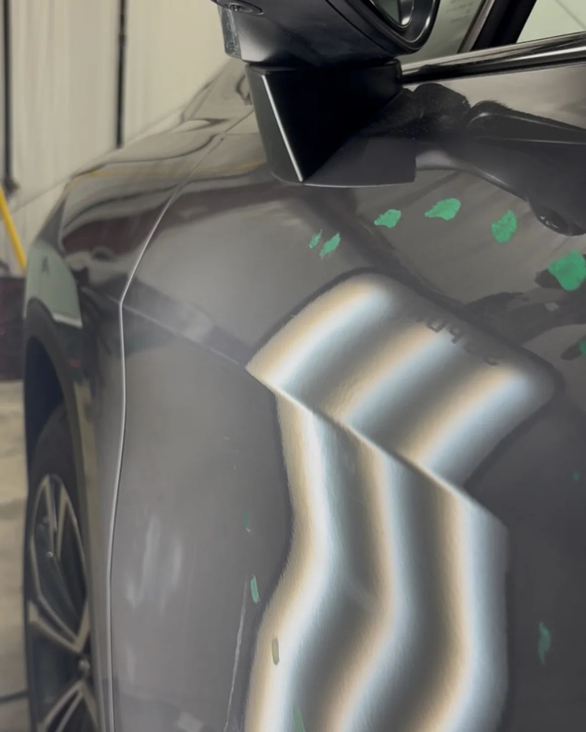After repair: smoother reflection lines across the repaired gray vehicle door